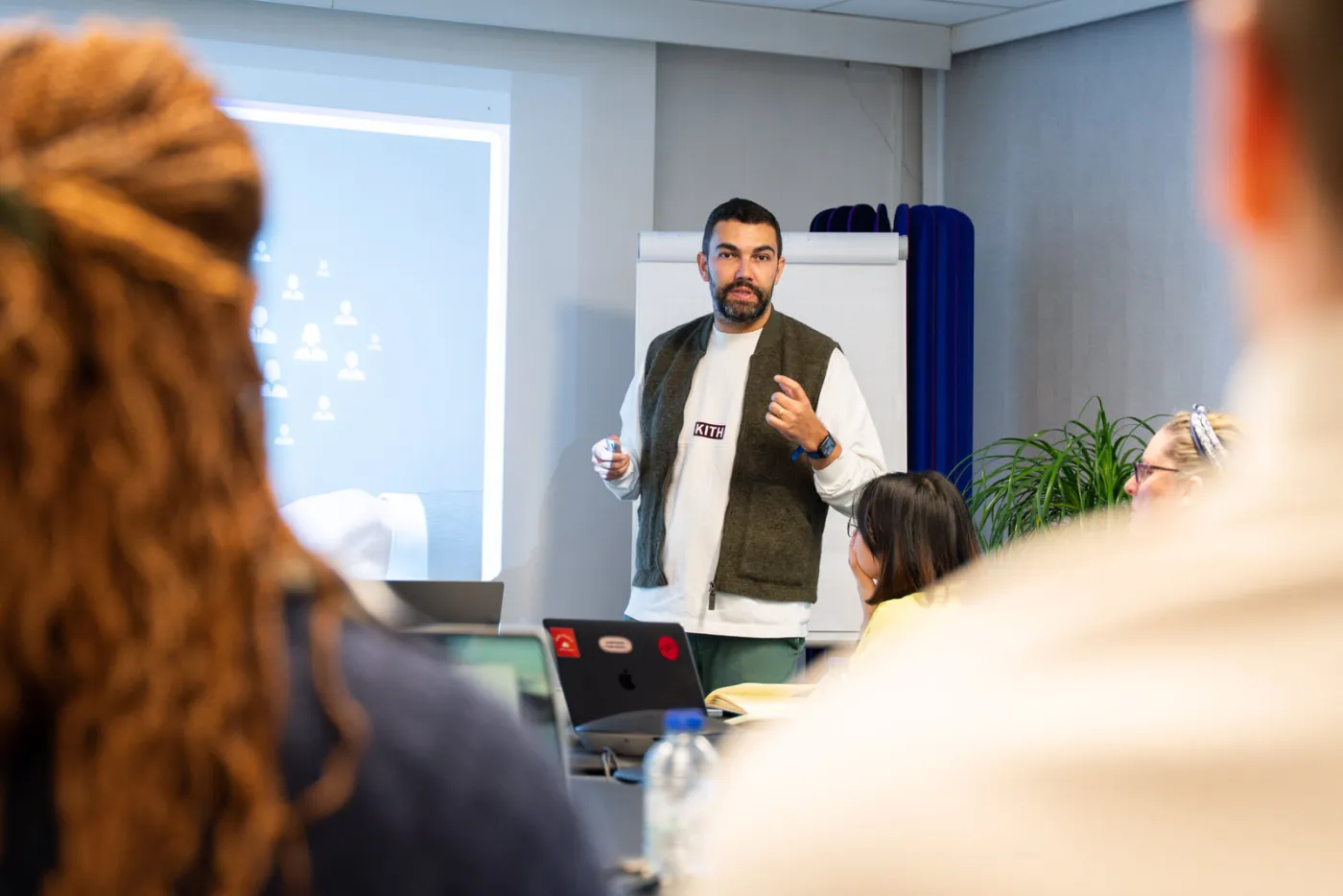 An instructor working through a live example with a commercial team