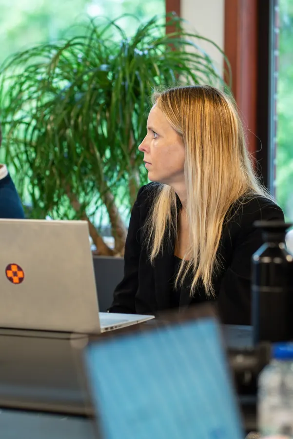 A participant working through an exercise on her laptop